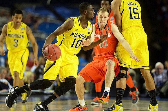 Trey Burke (3), Tim Hardaway Jr. (10), and Jon Horford (15)