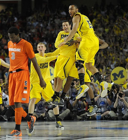 Blake McLimans (22), Josh Bartelstein (20), and Jon Horford (15)