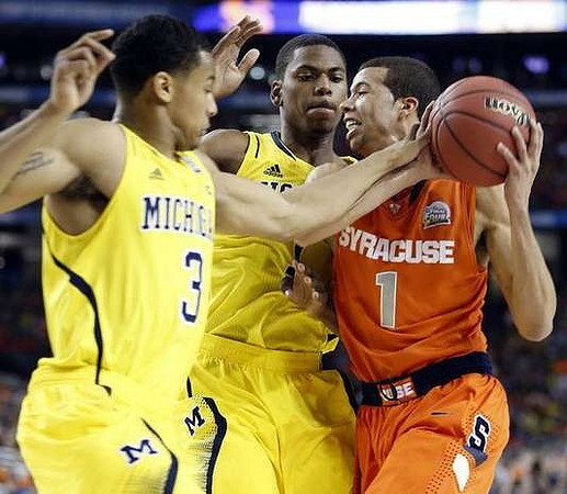 Trey Burke (3) and Glenn Robinson III (1)