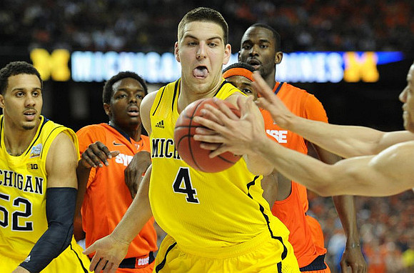 Jordan Morgan (52) and Mitch McGary (4)