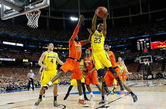 Mitch McGary (4), Tim Hardaway Jr. (10), Caris LeVert (23), and Spike Albrecht (2)