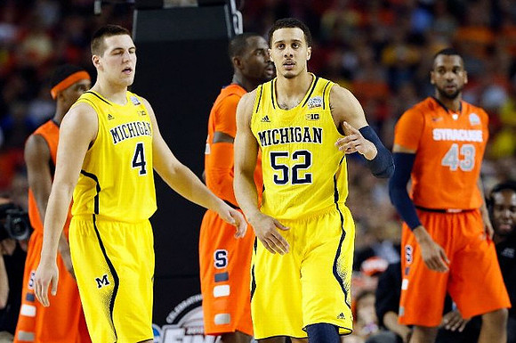 Mitch McGary (4) and Jordan Morgan (52)