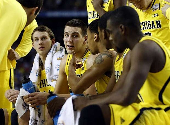 Nik Stauskas (11), Mitch McGary (4), Trey Burke (3), and Tim Hardaway Jr. (10)