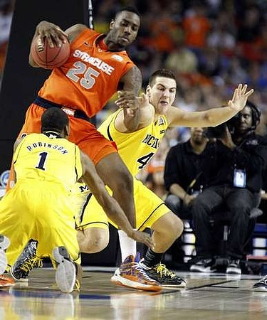 Glenn Robinson III (1) and Mitch McGary (4)