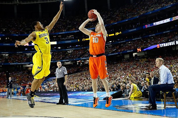 Trey Burke (3), Spike Albrecht (2), and John Beilein