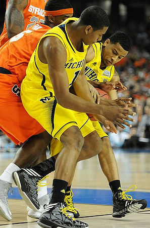 Glenn Robinson III (1) and Trey Burke (3)