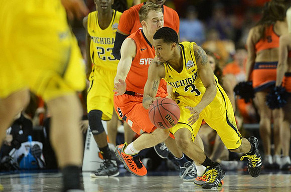 Caris LeVert (23) and Trey Burke (3)