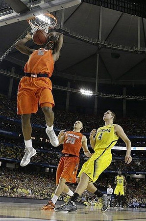 Mitch McGary (4) and Tim Hardaway Jr. (10)