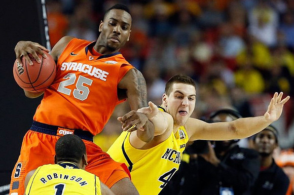 Glenn Robinson III (1) and Mitch McGary (4)