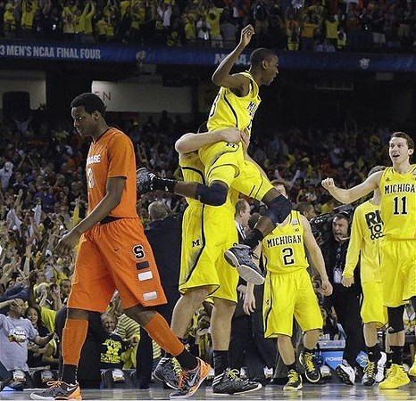Mitch McGary (4), Caris LeVert (23), Spike Albrecht (2), and Nik Stauskas (11)