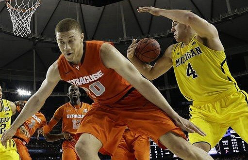Jordan Morgan (52) and Mitch McGary (4)