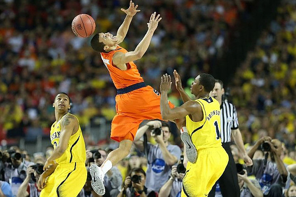 Trey Burke (3) and Glenn Robinson III (1)
