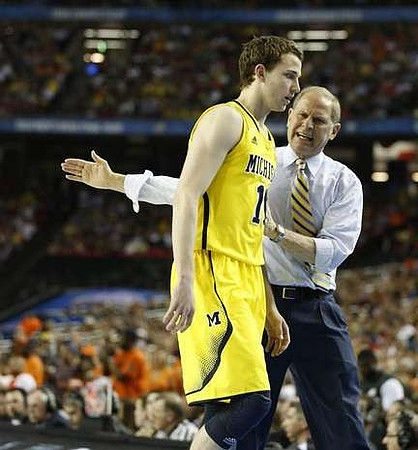 Nik Stauskas (11) and John Beilein