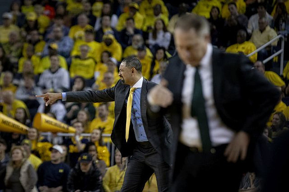 Juwan Howard and Michigan State Head Coach Tom Izzo