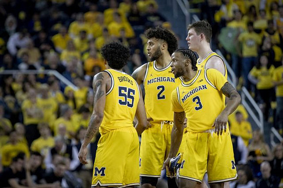 Eli Brooks (55), Isaiah Livers (2), Zavier Simpson (3), and Jon Teske (15)