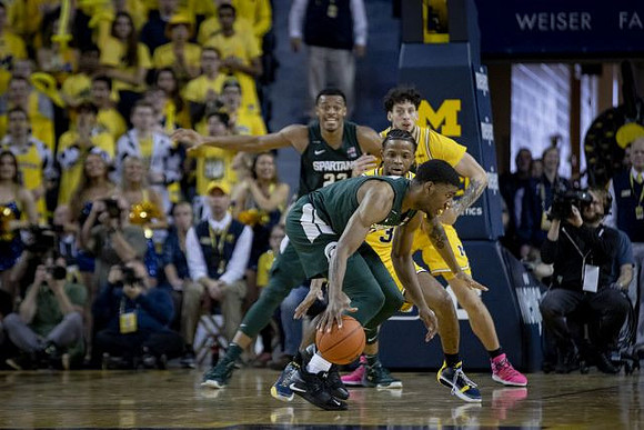 Zavier Simpson (3) and Brandon Johns Jr. (23)