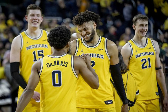 Jon Teske (15), David DeJulius (0), Isaiah Livers (2), and Franz Wagner (21)