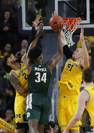 Isaiah Livers (2), Austin Davis (51), and Jon Teske (15)