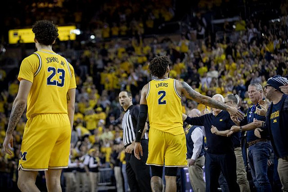 Brandon Johns Jr. (23) and Isaiah Livers (2)