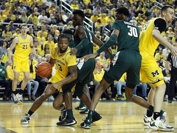Franz Wagner (21), Zavier Simpson (3), and Austin Davis (51)