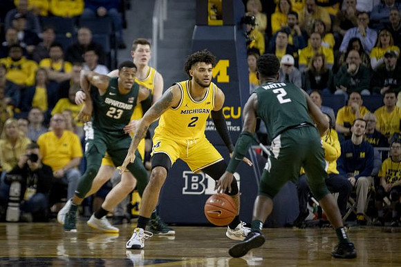 Jon Teske (15) and Isaiah Livers (2)
