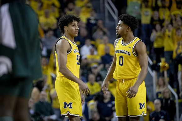 Eli Brooks (55) and David DeJulius (0)