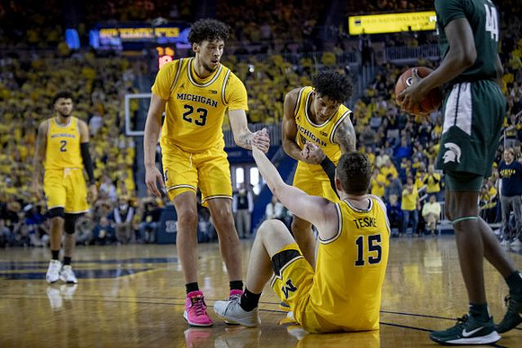 Isaiah Livers (2), Brandon Johns Jr. (23), Eli Brooks (55), and Jon Teske (15)