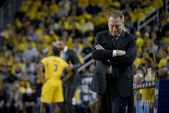 Zavier Simpson (3), Juwan Howard, and Michigan State Head Coach Tom Izzo