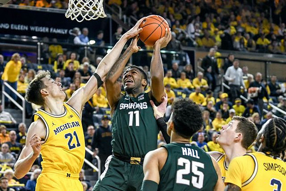 Franz Wagner (21), Jon Teske (15), and Zavier Simpson (3)