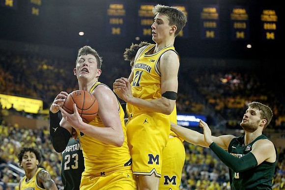 Eli Brooks (55), Jon Teske (15), Isaiah Livers (2), and Franz Wagner (21)