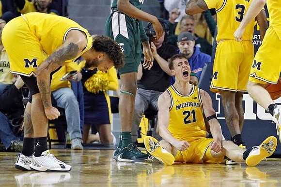 Isaiah Livers (2), Franz Wagner (21), and Zavier Simpson (3)