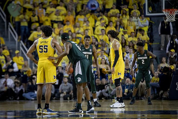 Eli Brooks (55) and Brandon Johns Jr. (23)