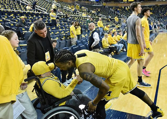 Zavier Simpson (3), Franz Wagner (21), and Brandon Johns Jr. (23)