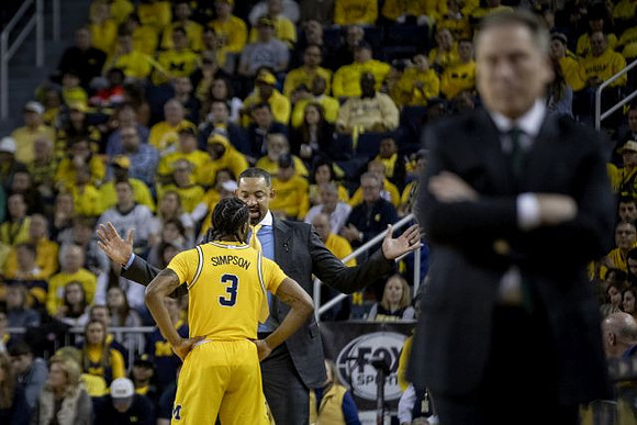 Zavier Simpson (3), Juwan Howard, and Michigan State Head Coach Tom Izzo