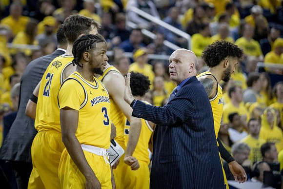 Isaiah Livers (2), Zavier Simpson (3), Phil Martelli, and Isaiah Livers (2)