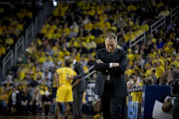 Zavier Simpson (3), Juwan Howard, and Michigan State Head Coach Tom Izzo
