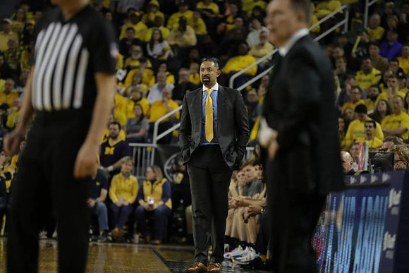 Juwan Howard and Michigan State Head Coach Tom Izzo