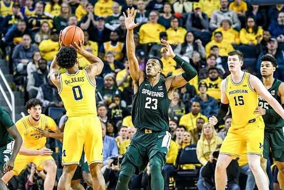 Brandon Johns Jr. (23), David DeJulius (0), and Jon Teske (15)