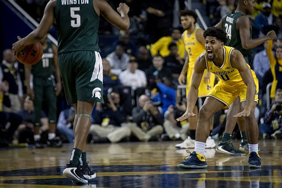David DeJulius (0) and Isaiah Livers (2)