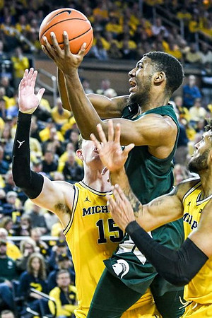 Jon Teske (15) and Isaiah Livers (2)