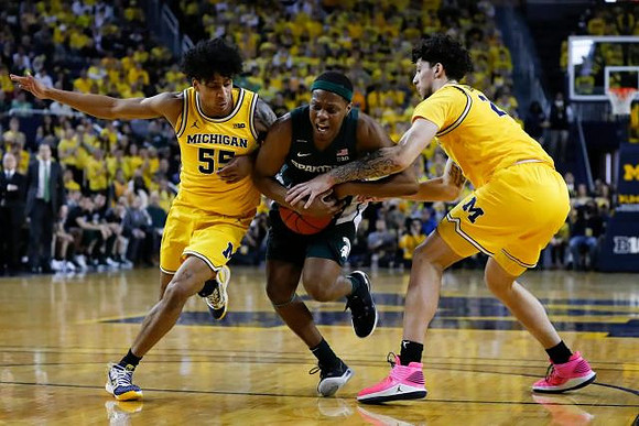 Eli Brooks (55) and Brandon Johns Jr. (23)