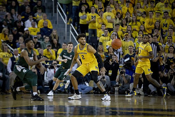 Isaiah Livers (2) and Zavier Simpson (3)