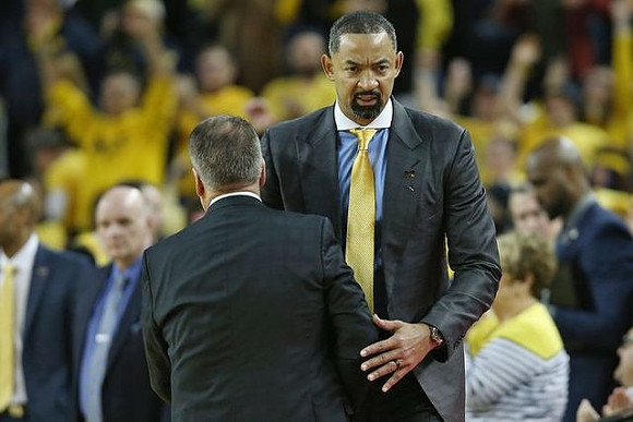 Michigan State Head Coach Tom Izzo and Juwan Howard