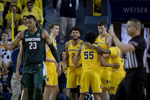 Franz Wagner (21), Isaiah Livers (2), Eli Brooks (55), Jon Teske (15), and Zavier Simpson (3)