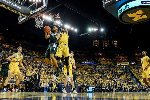Franz Wagner (21), Isaiah Livers (2), Jon Teske (15), and Zavier Simpson (3)