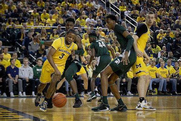 Zavier Simpson (3) and Austin Davis (51)