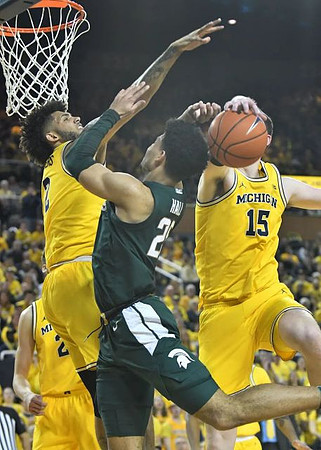 Franz Wagner (21), Isaiah Livers (2), and Jon Teske (15)