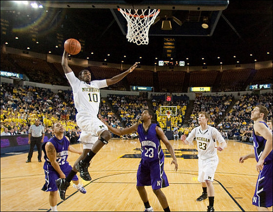 Tim Hardaway Jr. (10) and Evan Smotrycz (23)