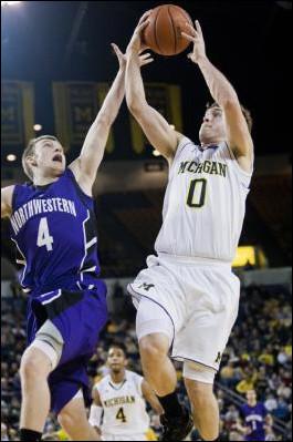 Darius Morris (4) and Zack Novak (0)