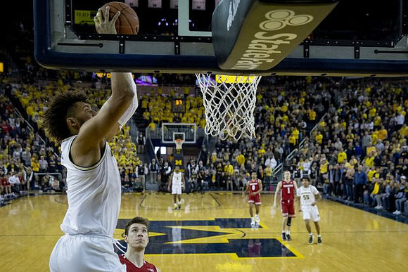Isaiah Livers (4), Zavier Simpson (3), and Eli Brooks (55)